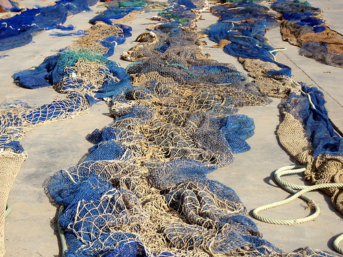 discarded nets on the beach